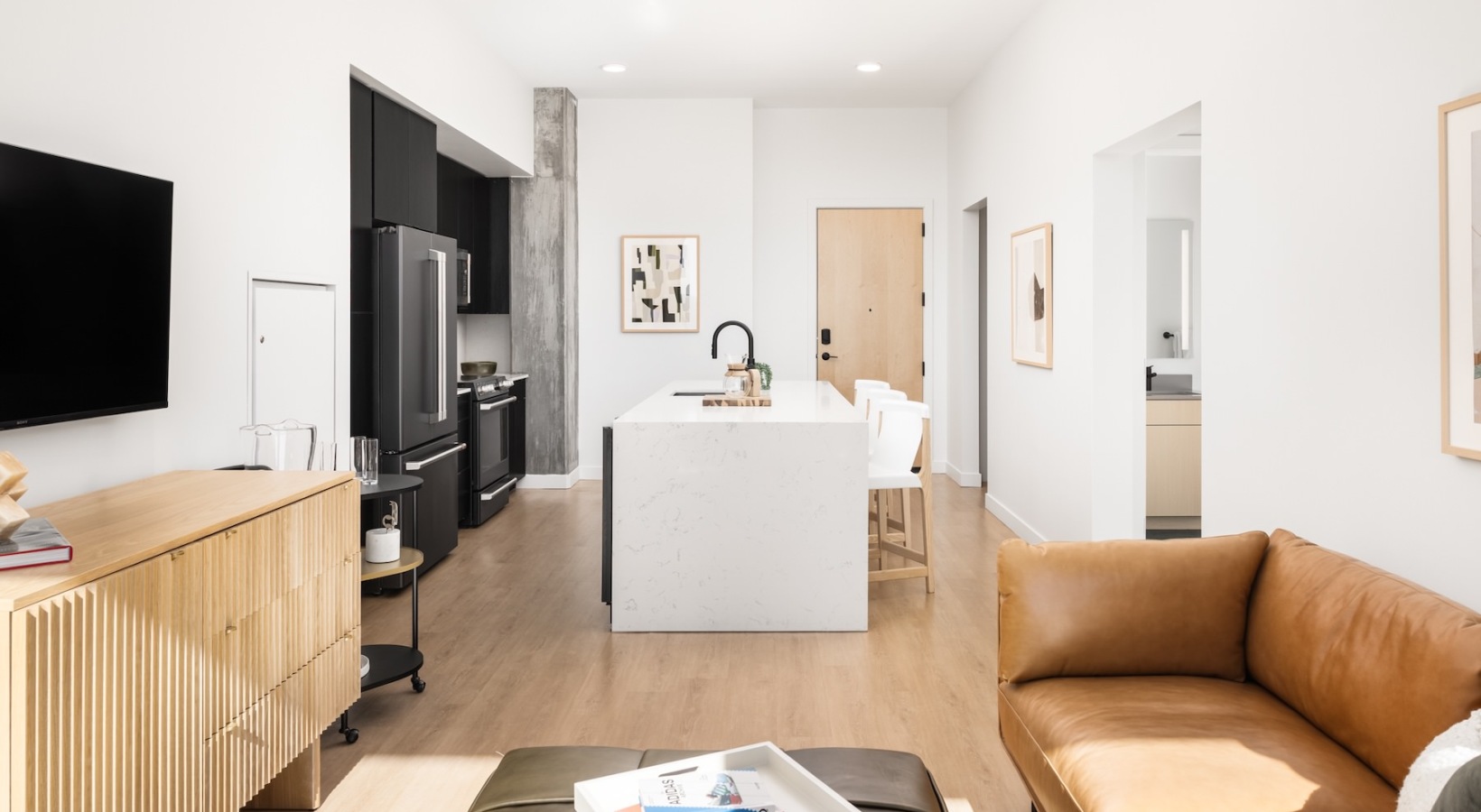 Spacious and well-lit living spaces open living room with large windows