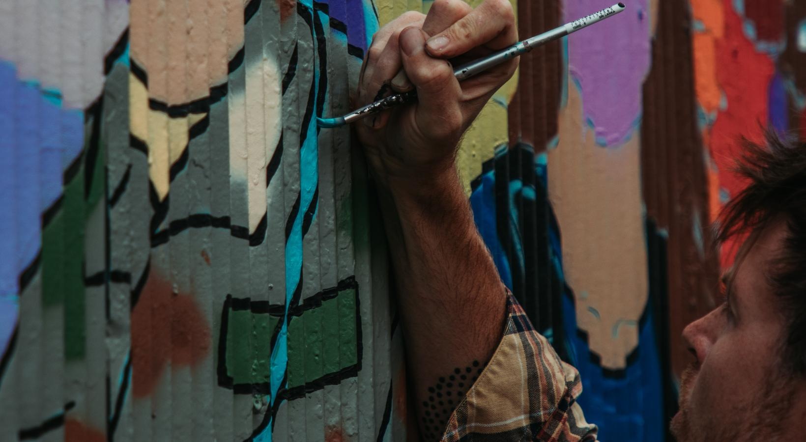 Settle into comfort at FoundryLine a person painting a wall