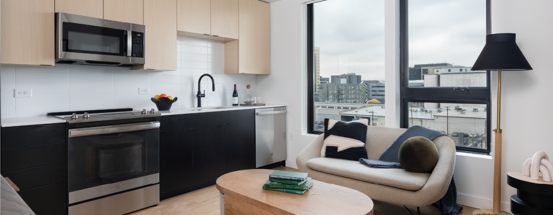 a kitchen and living room with seating