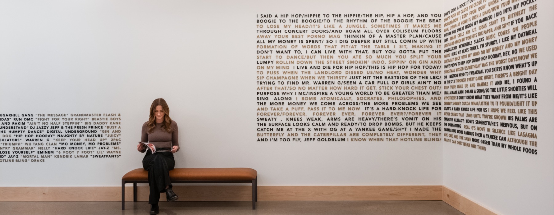a woman reading in an art gallery
