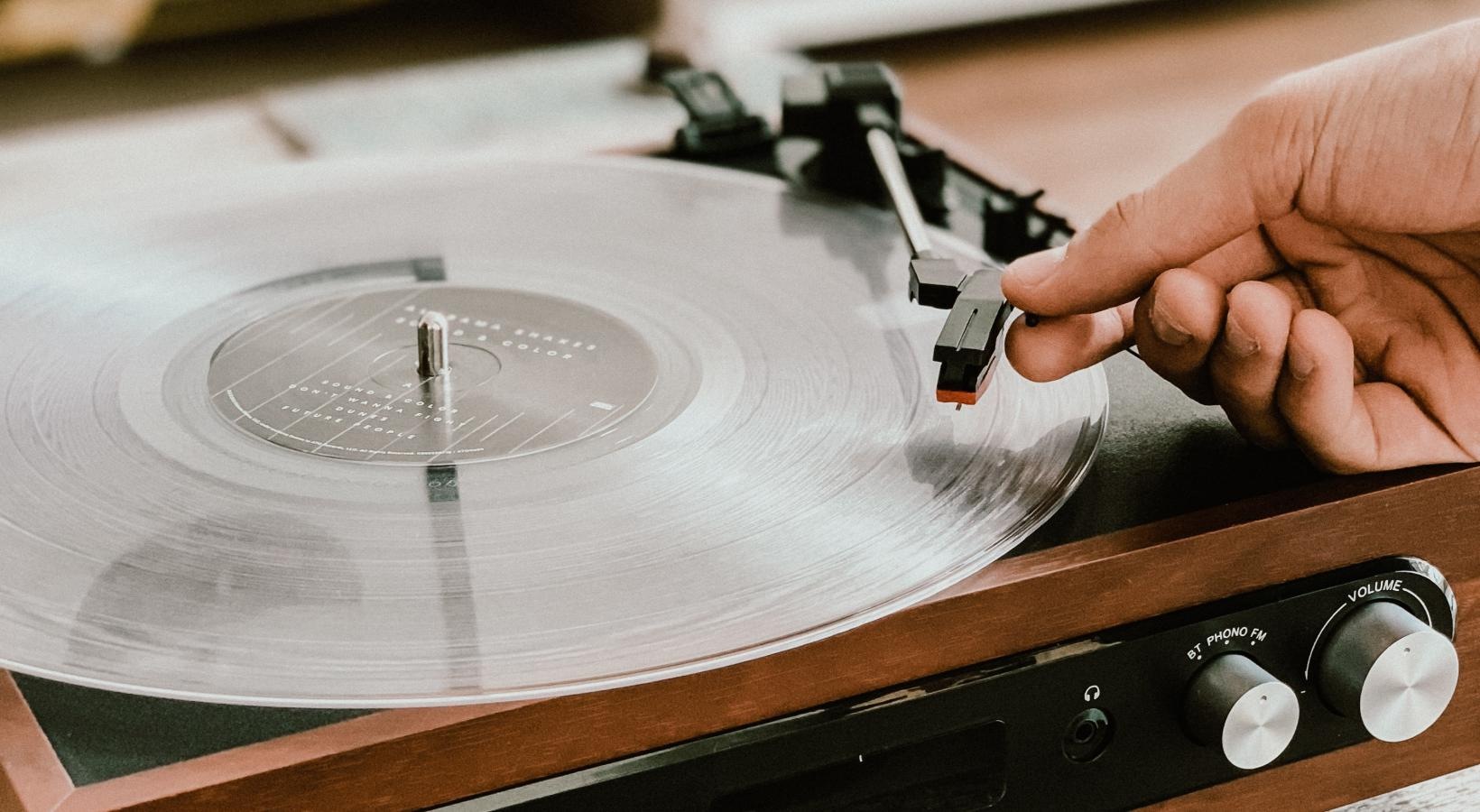 The essence of exceptional living a hand holding a record player